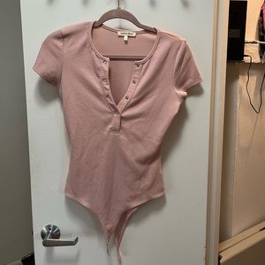 Pink ribbed body suit